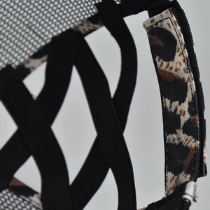 Detail of leopard print trim and black mesh ponytail cross-band on a baseball cap