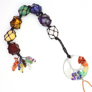 Macro view of 7 Chakra tumbled stones and Tree of Life pendant for car or home decor