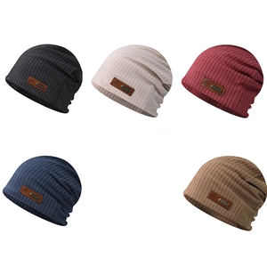 Pack of five ribbed knit beanies in black, cream, burgundy, navy, and brown with fishbone patch