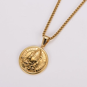 Detailed close-up of golden prayer hands pendant with MORS CERTA engraving on box chain