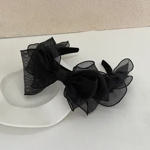 French vintage black mesh layered bow headband with subtle glitter on a thin frame
