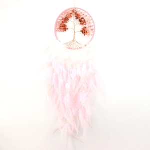 Detail of pink crystal Tree of Life dream catcher with soft feathers and pearls