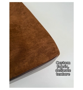 Close-up of brown suede fabric texture and professional stitching on the HOBO shoulder bag