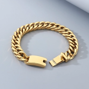 Macro detail of 12mm golden stainless steel Cuban chain bracelet with polished finish