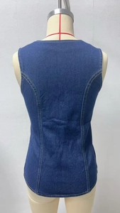Detailed back view of vintage dark blue denim vest with slim fit waist and racerback design