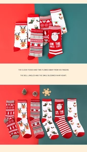 Detail view of six diverse Christmas crew socks with Santa, reindeer and snowflake patterns