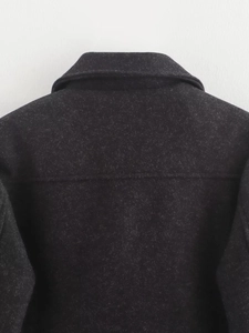 Detailed back view of round neck black wool jacket showing premium fabric texture