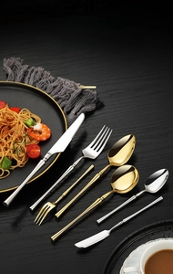 Close-up of luxury 304 stainless steel cutlery set with mirror finish on dark wood table