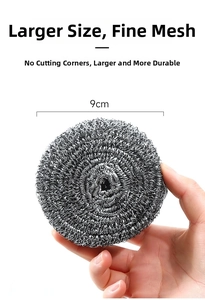 Detail of 9cm extra large fine mesh stainless steel scrubber held in hand for scale