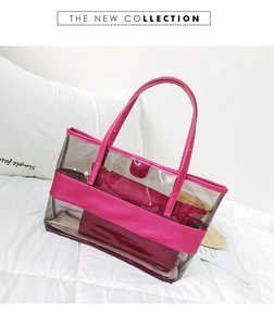 Detail of transparent grey PVC tote bag with rose pink trim and matching inner pouch