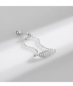 Close-up of adjustable silver feather ring with sparkling zircon and soft chain link