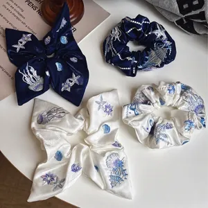 Navy and white satin scrunchie set with ocean embroidery of starfish and jellyfish