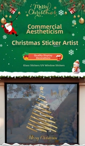 Close-up of golden spiral Christmas tree window sticker with Merry Christmas text