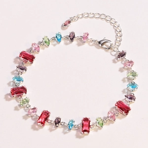 Detailed shot of silver bracelet with colorful zircon stones in various shapes and sizes