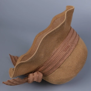 Caramel knitted wide-brim sun hat with sweet bow decoration and wavy summer texture
