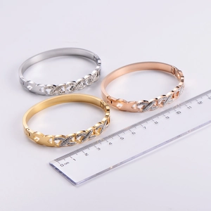 Detailed size comparison of gold, silver, and rose gold diamond-set infinity bracelets