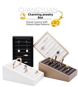 Detailed slots of jewelry display stands for rings earrings and bracelets organizer