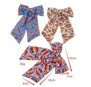 Rugby themed bow hair clips in blue, grey, and purple with detailed size and weight specs