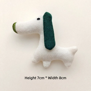 White knitted puppy charm with green ears, textile accessory, size H 7cm x W 8cm