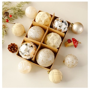 Detail of luxury gold and silver Christmas ornaments with glitter and textures in a gift box
