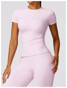 Detail of lilac quick-dry yoga top featuring premium elastic fabric and neat stitching