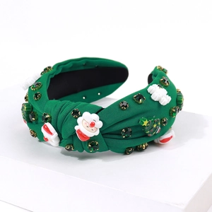 Detail of dark green knot headband with Santa Claus motif and green rhinestones