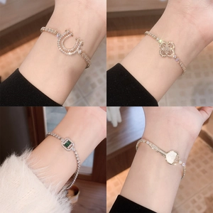 Elegant gold-plated bracelet set with clover, horseshoe, and zircon charms for women