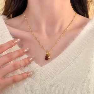 Gold plated gourd pendant necklace worn on neck with elegant minimalist design