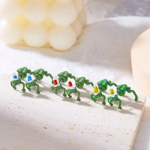 Funny green frog earrings wearing colorful Santa hats for festive Christmas styling