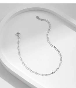 Detail of s925 silver hollow paperclip chain necklace with extension on white tray