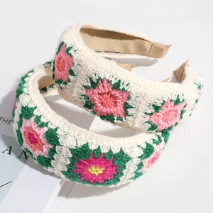 Detailed view of handmade crochet headbands with vintage floral knit embroidery patterns