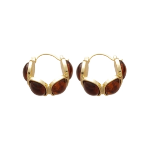 Amber resin C-shaped hoop earrings with gold metal base on a clean white background