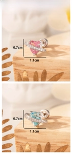 Detailed view of 1.1cm heart planet titanium steel stud earrings with pink and blue stones