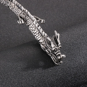 Macro shot of punk style dragon head bracelet with antique silver finish details