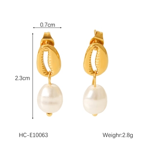 Detail view of shell-shaped gold earrings with Baroque pearls showing 2.3cm length