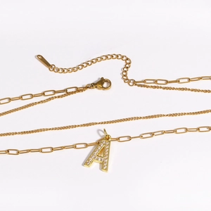 Double-layered gold necklace with paperclip chain and zircon-inlaid letter A pendant