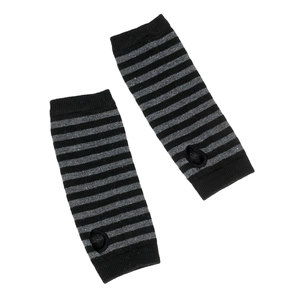 Close-up of black and grey striped knitted arm warmers with thumb holes and soft texture