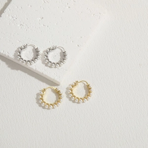 Elegant 14K gold and silver plated hoop earrings with white pearls on a stone base