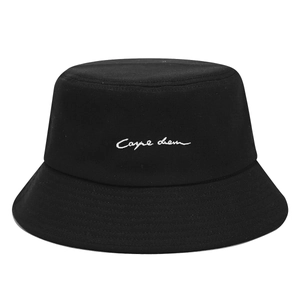 Black cotton bucket hat featuring white Carpe Diem embroidery on a clean white background