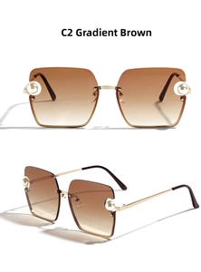 Detail of gradient tea lenses and pearl accents on gold metal square sunglasses