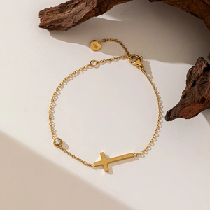 Elegant 18K gold-plated necklace with minimalist cross pendant and sparkling zircon stone