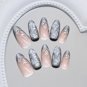 Blue cat eye press-on nails with silver leaf and flower embossed art in almond shape