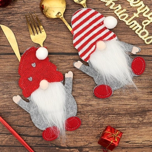 Christmas gnome cutlery holders in red and grey felt for festive holiday table settings