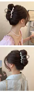 Detailed view of acrylic heart hair clips in smoky grey on hair from side and back