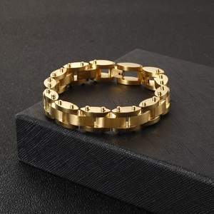 Close-up of golden stainless steel heavy link chain bracelet on a black gift box