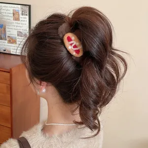 Furry brown hair claw clip featuring creative wool felt hot dog design for women