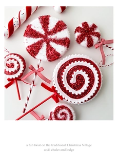 Macro detail of red and white glitter candy cane ornaments with ribbon on white background
