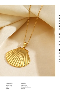 Detailed macro shot of golden shell pendant with radiant texture on silk background
