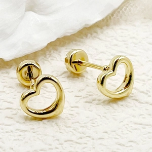 Minimalist 14K gold plated stainless steel heart stud earrings on white fabric