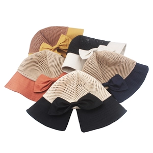 Women's bow hollow straw sun hats in five colors for summer beach UV protection